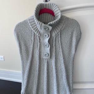 Gorgeous BCBG knitwear.Capped sleeve, highneck button top, flattering stitching